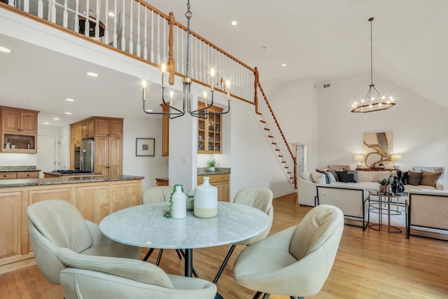 1700 Cornell Ct, Lake Forest, IL 60045 - dining space with a chandelier, light wood-style flooring, recessed lighting, stairs, and high vaulted ceiling