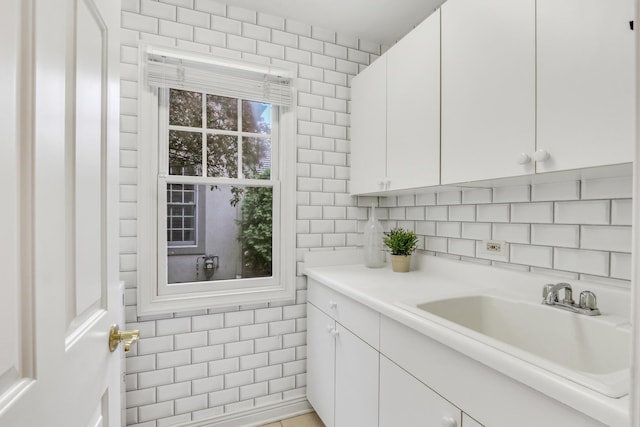 1700 Cornell Ct, Lake Forest, IL 60045 - bathroom with tile walls, vanity, and tasteful backsplash