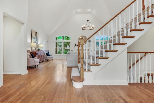 1700 Cornell Ct, Lake Forest, IL 60045 - foyer featuring hardwood / wood-style flooring, stairs, vaulted ceiling, and a chandelier