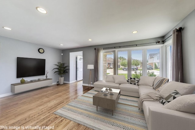 7665 W Victoria St, Chicago, IL 60631 - living area featuring light wood finished floors, recessed lighting, and baseboards