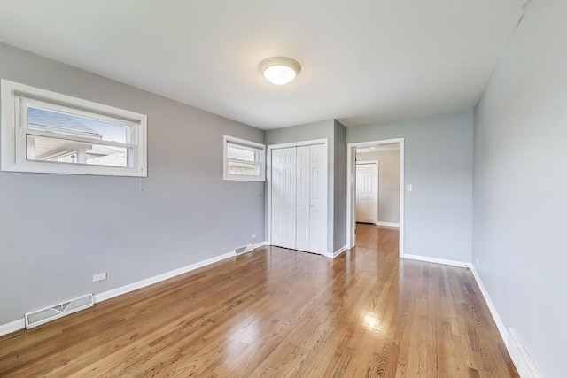 7665 W Victoria St, Chicago, IL 60631 - unfurnished bedroom featuring wood finished floors, baseboards, and a closet