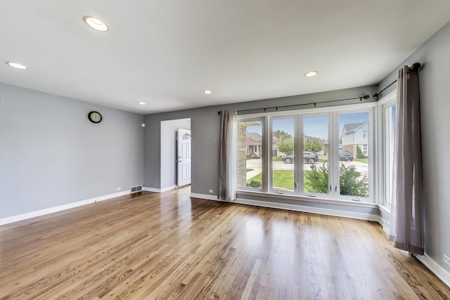 7665 W Victoria St, Chicago, IL 60631 - empty room featuring recessed lighting, wood finished floors, and baseboards
