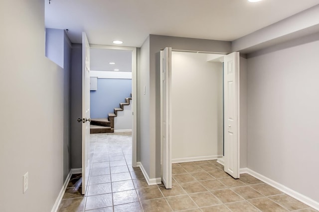 7665 W Victoria St, Chicago, IL 60631 - corridor with stairs, light tile patterned floors, recessed lighting, and baseboards
