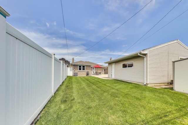 7665 W Victoria St, Chicago, IL 60631 - view of yard featuring central AC unit and a patio area