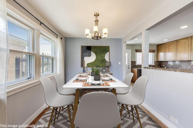 7665 W Victoria St, Chicago, IL 60631 - dining room with baseboards, a chandelier, wood finished floors, and recessed lighting