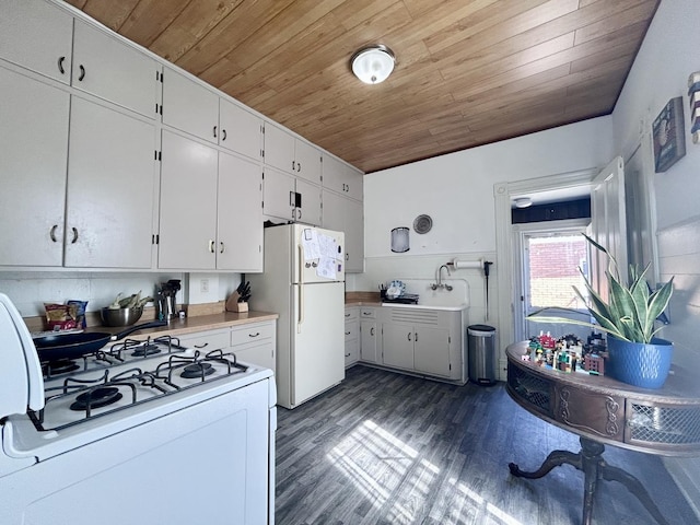 252 Jefferson Ave, Elgin, IL 60120 - kitchen featuring white appliances, wooden ceiling, dark wood-style flooring, a sink, and white cabinetry