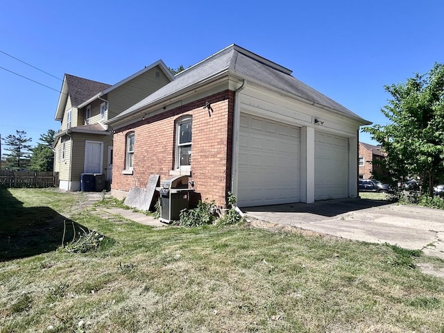 252 Jefferson Ave, Elgin, IL 60120 - view of home's exterior featuring brick siding and a garage