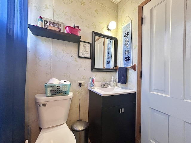 252 Jefferson Ave, Elgin, IL 60120 - bathroom with wallpapered walls, vanity, and toilet