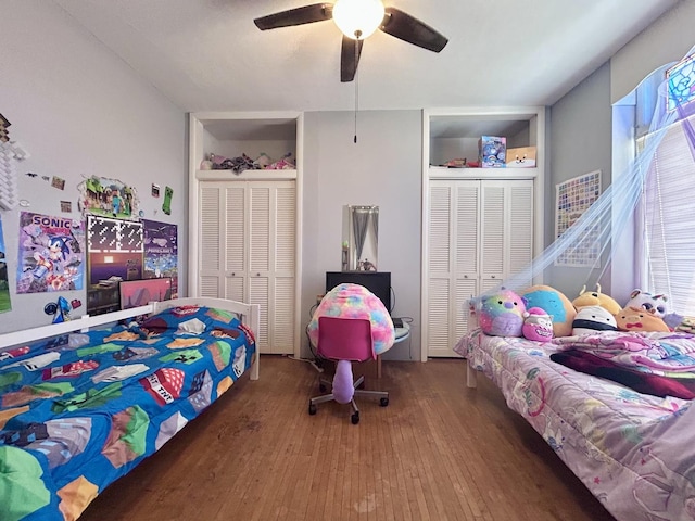 252 Jefferson Ave, Elgin, IL 60120 - bedroom with hardwood / wood-style flooring, two closets, and ceiling fan
