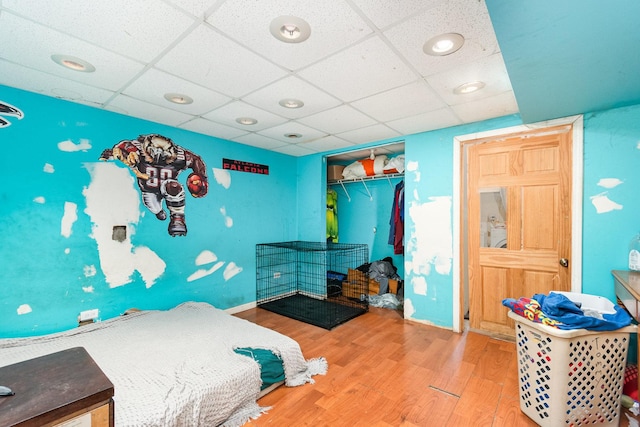 2600 John Bourg Dr, Plainfield, IL 60586 - bedroom featuring a paneled ceiling, wood finished floors, a closet, baseboards, and recessed lighting