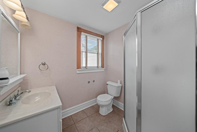 508 Grant St, Earlville, IL 60518 - bathroom with a shower stall, vanity, tile patterned floors, toilet, and baseboards
