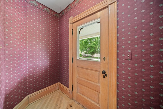 508 Grant St, Earlville, IL 60518 - doorway with wallpapered walls, baseboards, and wood finished floors