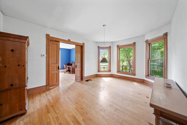 508 Grant St, Earlville, IL 60518 - unfurnished dining area with light wood finished floors and baseboards