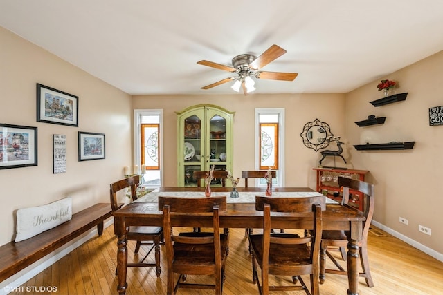 524 Crown Point Dr, Buffalo Grove, IL 60089 - dining area with ceiling fan, light wood finished floors, and baseboards