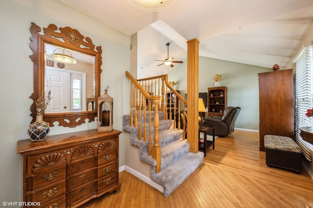 524 Crown Point Dr, Buffalo Grove, IL 60089 - stairs with hardwood / wood-style flooring, ceiling fan, baseboards, and vaulted ceiling