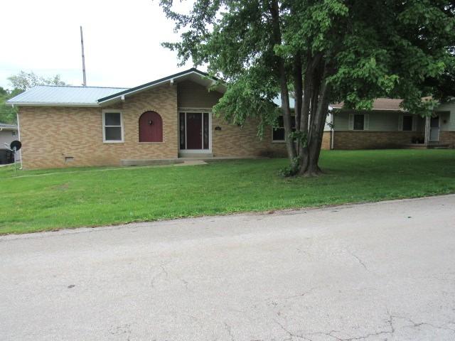 309 Cedar Dr, Clinton, IL 61727 - ranch-style house featuring a front yard and brick siding