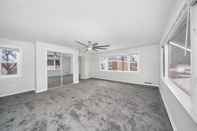 3900 Home Ave, Stickney, IL 60402 - unfurnished bedroom featuring carpet floors, multiple windows, baseboards, and a ceiling fan