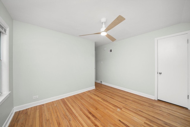 3900 Home Ave, Stickney, IL 60402 - unfurnished bedroom with light wood-style floors, baseboards, and a ceiling fan