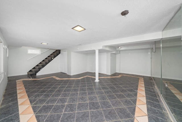 3900 Home Ave, Stickney, IL 60402 - finished basement with stairs, baseboards, and a textured ceiling