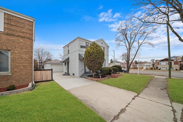 3900 Home Ave, Stickney, IL 60402 - view of front of home featuring a front lawn, a detached garage, a residential view, and brick siding