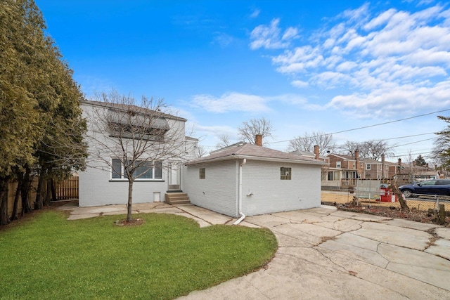 3900 Home Ave, Stickney, IL 60402 - back of house featuring brick siding, entry steps, a chimney, and a patio area