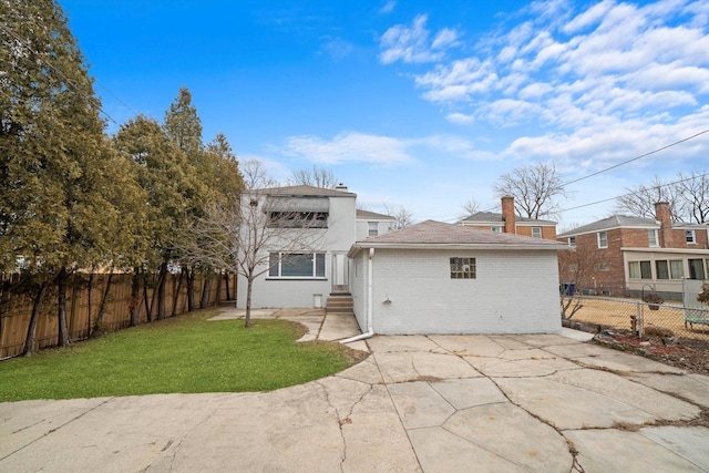 3900 Home Ave, Stickney, IL 60402 - rear view of house with brick siding and a patio area