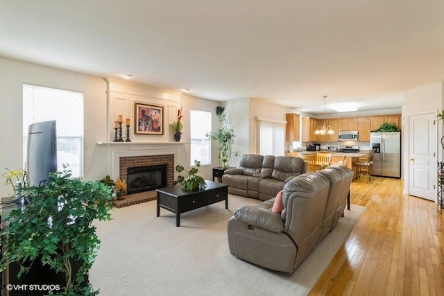 6 Marigold Ln, Algonquin, IL 60102 - living area with a brick fireplace and light wood finished floors