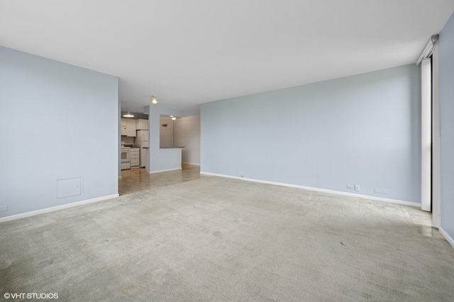 1850 N Clark St Unit 402, Chicago, IL 60614 - unfurnished living room with baseboards and light colored carpet