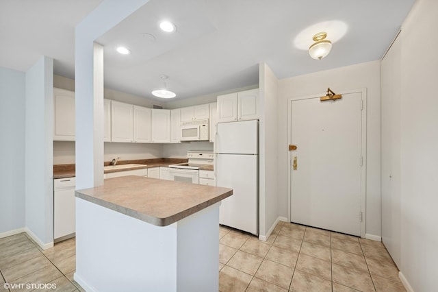 1850 N Clark St Unit 402, Chicago, IL 60614 - kitchen with white appliances, white cabinets, baseboards, a sink, and recessed lighting