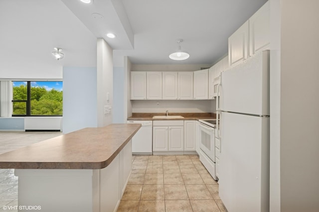 1850 N Clark St Unit 402, Chicago, IL 60614 - kitchen with white appliances, white cabinets, a sink, a kitchen island, and recessed lighting
