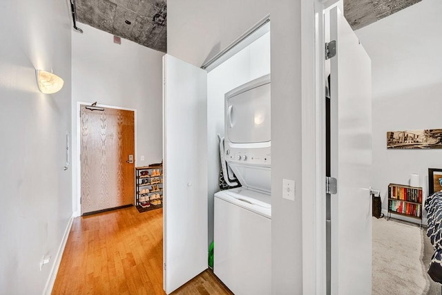 320 E 21st St Unit 412, Chicago, IL 60616 - laundry area with stacked washer / drying machine and light wood-type flooring