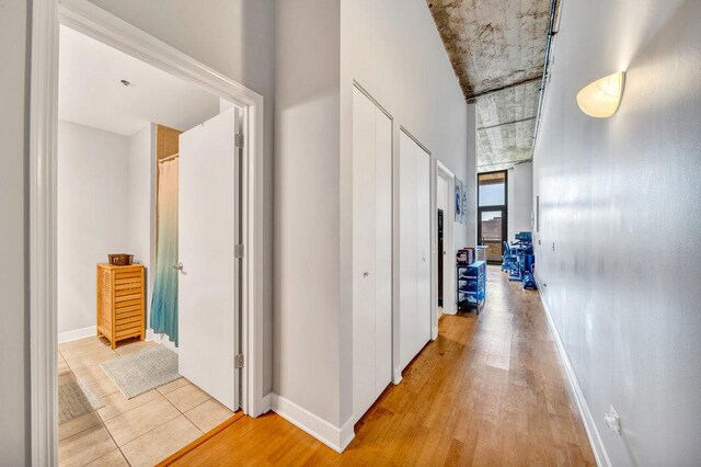 320 E 21st St Unit 412, Chicago, IL 60616 - hallway with baseboards and light wood-style flooring