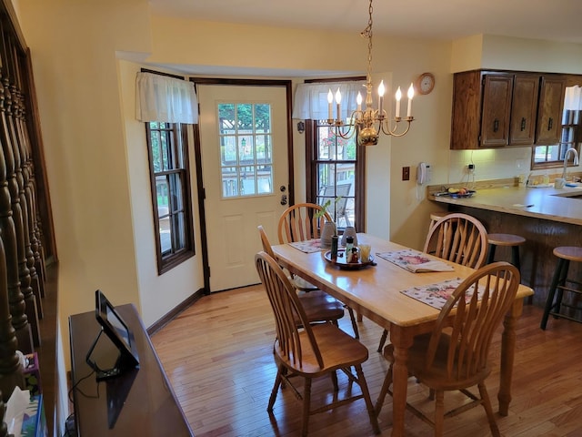1263 Bainbridge Dr, Naperville, IL 60563 - dining area featuring light wood finished floors and a chandelier