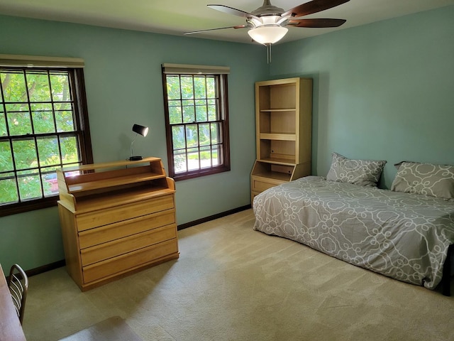 1263 Bainbridge Dr, Naperville, IL 60563 - bedroom featuring multiple windows, light carpet, baseboards, and ceiling fan