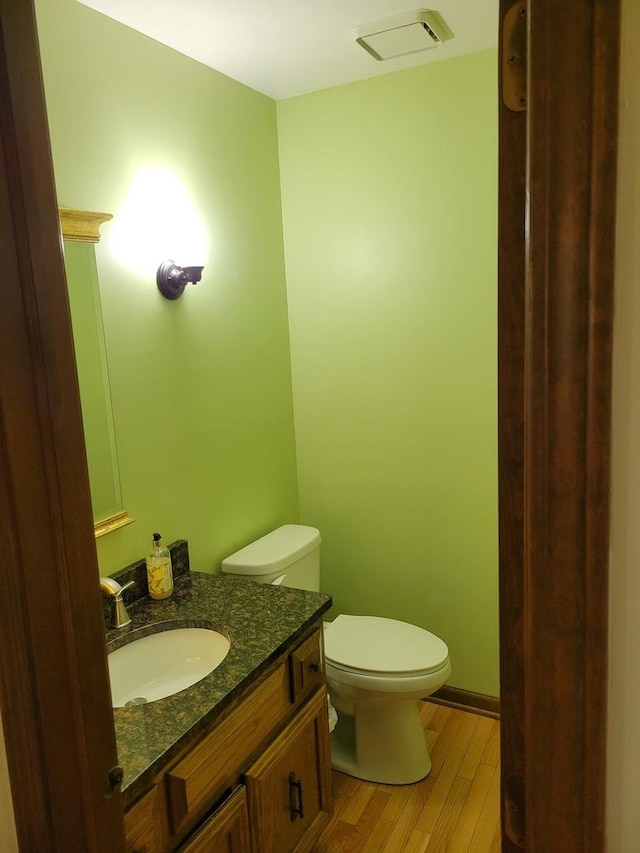 1263 Bainbridge Dr, Naperville, IL 60563 - bathroom with toilet, vanity, and wood finished floors