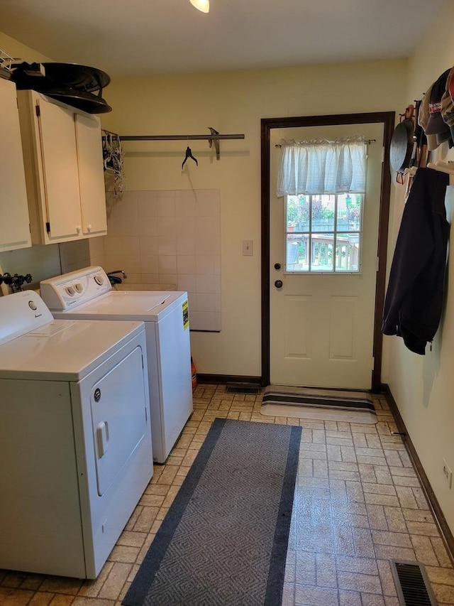 1263 Bainbridge Dr, Naperville, IL 60563 - laundry area with cabinet space, washer and dryer, and baseboards