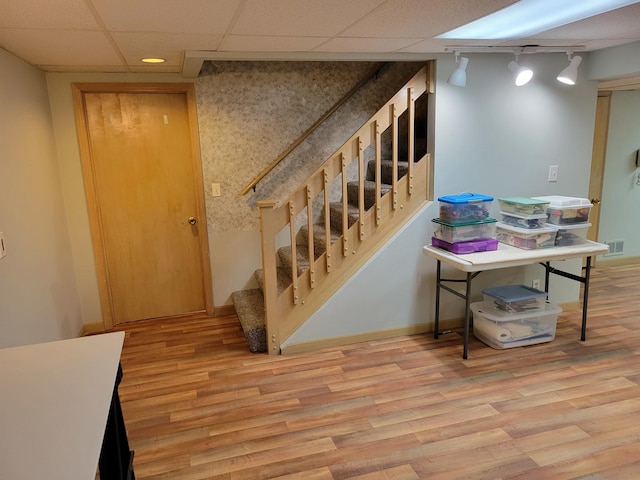 1263 Bainbridge Dr, Naperville, IL 60563 - stairs featuring wood finished floors, track lighting, a drop ceiling, and baseboards
