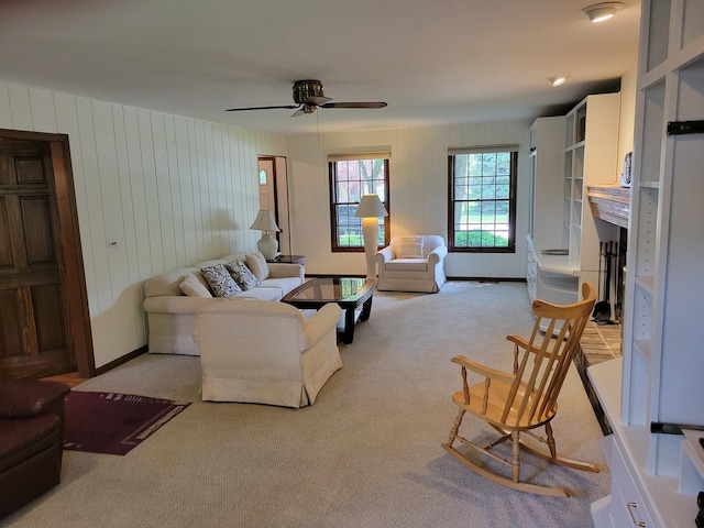 1263 Bainbridge Dr, Naperville, IL 60563 - living area with light carpet, a ceiling fan, and wood walls