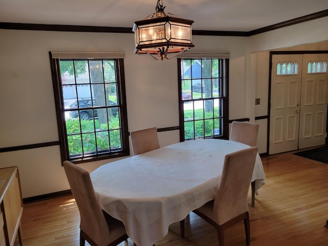 1263 Bainbridge Dr, Naperville, IL 60563 - dining area with a chandelier, ornamental molding, light wood-type flooring, and baseboards
