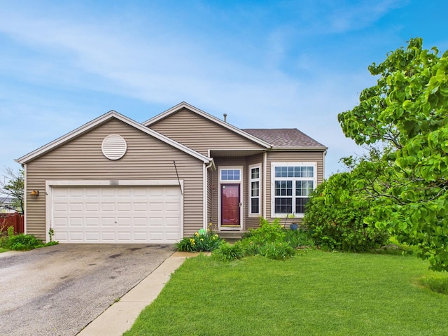 364 Coneflower Dr, Minooka, IL 60447 - view of front facade with asphalt driveway, a front yard, and a garage