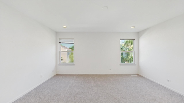 2156 Skylane Dr, Naperville, IL 60564 - spare room featuring light colored carpet, baseboards, and recessed lighting