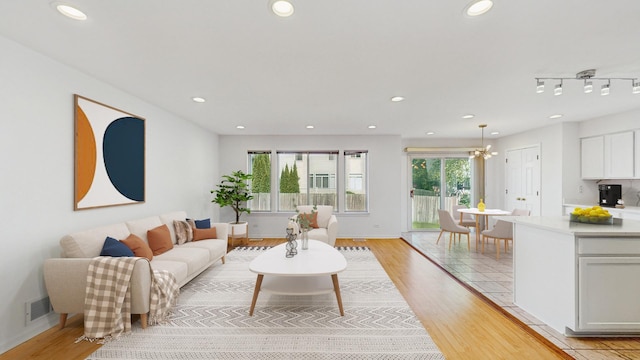 2156 Skylane Dr, Naperville, IL 60564 - living area featuring light wood-style flooring, recessed lighting, and baseboards