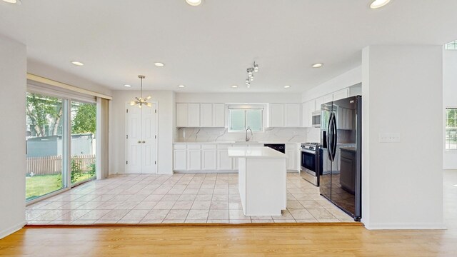 2156 Skylane Dr, Naperville, IL 60564 - kitchen with appliances with stainless steel finishes, light countertops, backsplash, healthy amount of natural light, and recessed lighting