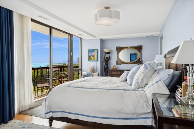 2314 N Lincoln Park W Unit 11S, Chicago, IL 60614 - bedroom with access to outside, wood finished floors, and a water view