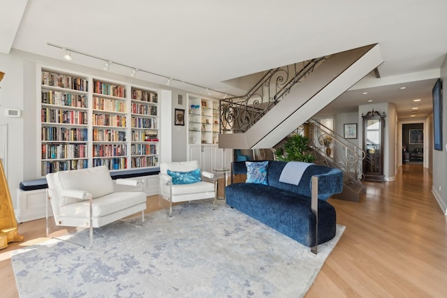 2314 N Lincoln Park W Unit 11S, Chicago, IL 60614 - living room featuring wood finished floors, stairway, track lighting, and built in features