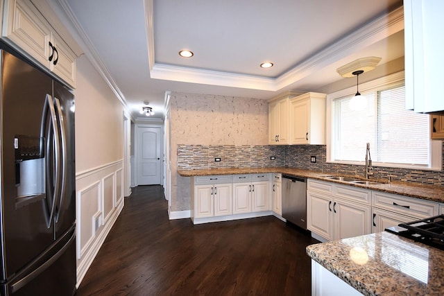 5009 W 79th Pl, Burbank, IL 60459 - kitchen featuring appliances with stainless steel finishes, a sink, a raised ceiling, dark wood-type flooring, and stone countertops