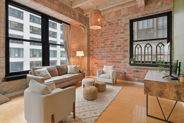 20 N State St Unit 805, Chicago, IL 60602 - living room featuring brick wall, baseboards, and wood finished floors