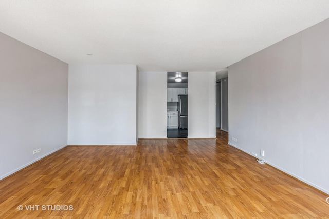 6700 S S Shore Dr Unit 5E, Chicago, IL 60649 - empty room with light wood-style floors and baseboards