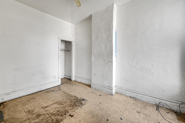 4728 S Evans Ave, Chicago, IL 60615 - unfurnished bedroom featuring tile patterned floors and a ceiling fan