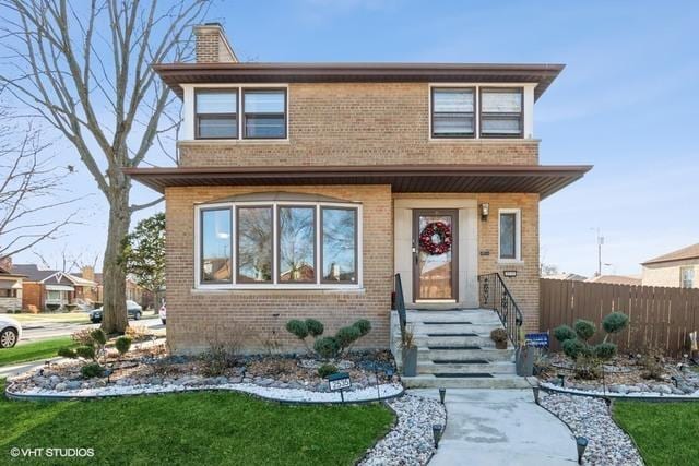 2535 W 116th Pl, Chicago, IL 60655 - view of front of home featuring brick siding and a chimney